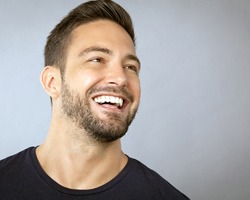 Man smiling after periodontal therapy