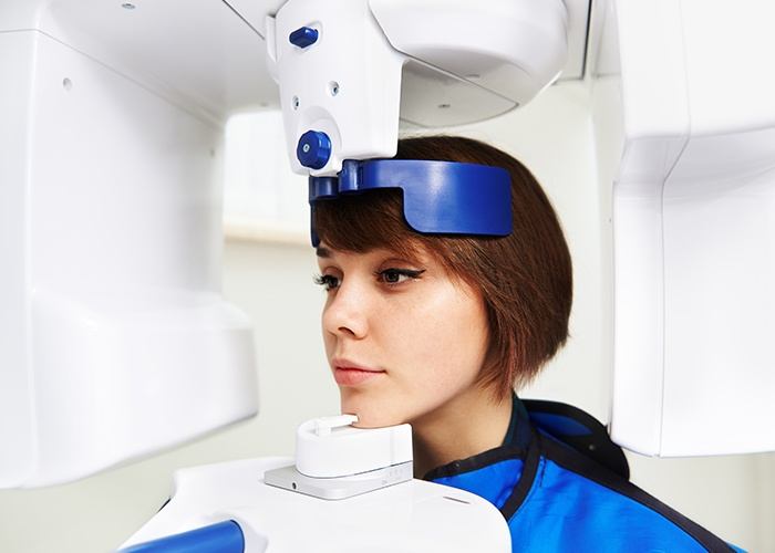 Woman receiving C T dental x ray scan