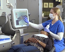 Dentist showing patient digital dental impressions