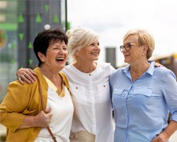 Group of adult friends smiling outside