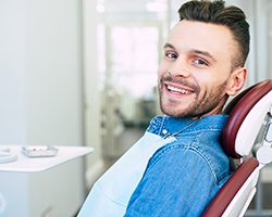 Male dental patient sitting in dental chair