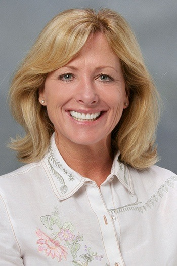 Female patient with flawless smile after treatment