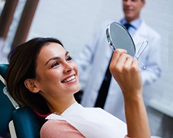 a patient smiling after getting cosmetic dentistry in Louetta