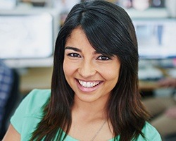 Young woman with flawless smile after Lumineers