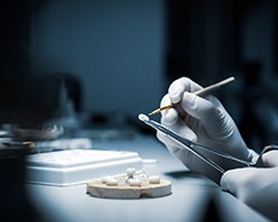 Implant dentist in Houston designing restoration for dental implants