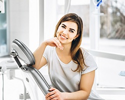 Smiling woman with dental implants in Louetta at the dentist