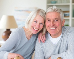 older couple with dentures smiling