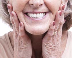 patient smiling with dentures in Houston