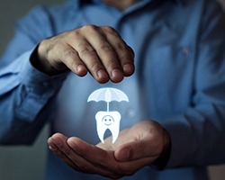 illustration of tooth under umbrella for dental insurance   