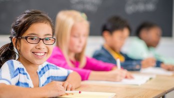 Smiling young girl in classroom