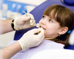 Young girl receiving dental exam