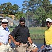 Three men golfing