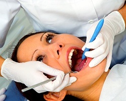 Woman receiving periodontal therapy