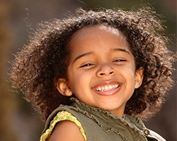 Little girl with healthy smile at children's dentistry visit