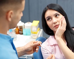 Patient talking to dentist about root canal therapy