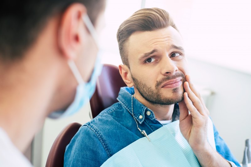 Man seeking emergency dentistry for dental injury