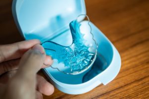 Close up of retainer with blue base in its case