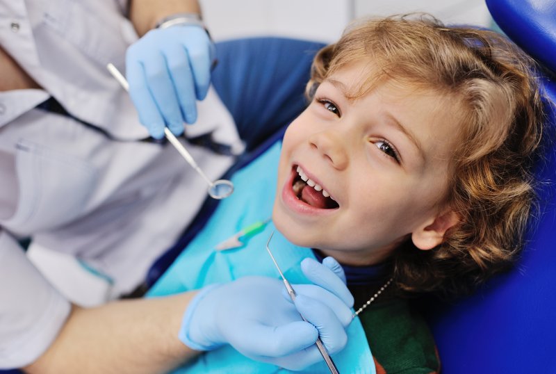 child smiling at the dentist 
