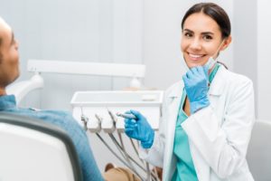 Dentist treating a patient with TMJ disorder.