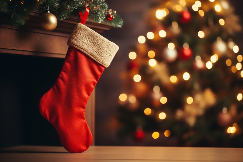 a single red stocking hanging on a mantle