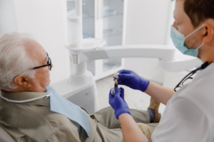 a patient during a dental implant consultation