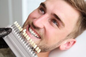 Man looking at veneer color options